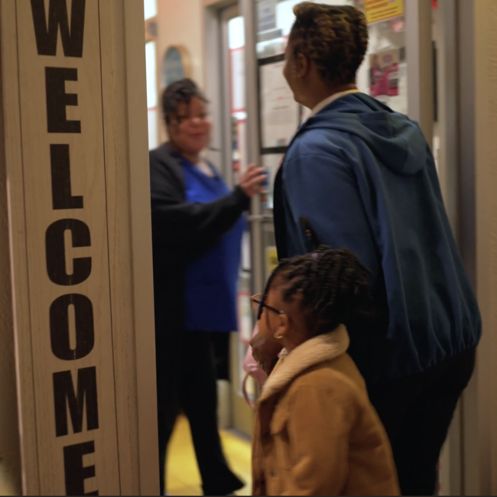 Family walking into a childcare facility