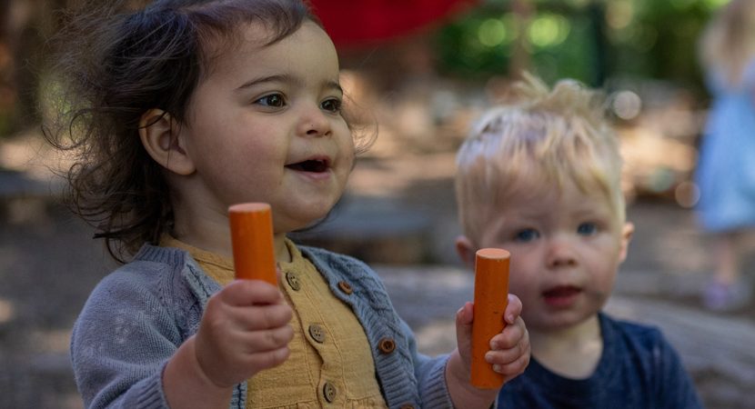 Children playing with chalk outside